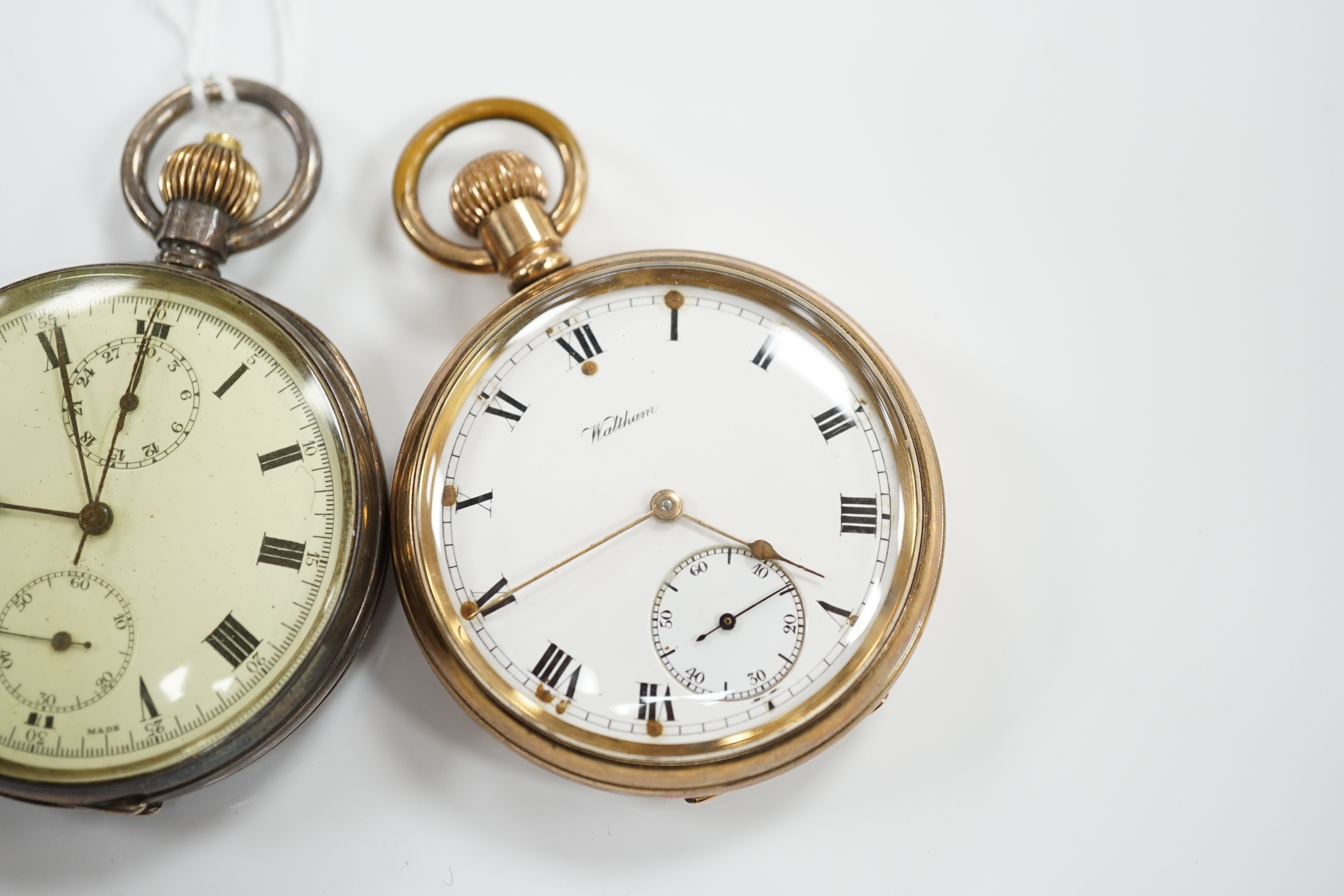 A Swiss 935 white metal open faced keyless pocket watch and a Waltham gold plated pocket watch.